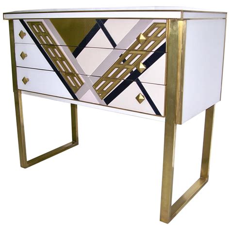 Find this gold chest inside the final room of the world's grave. 1990s Italian Unique White Black and Gold Chest or Sideboard on Brass Legs For Sale at 1stdibs