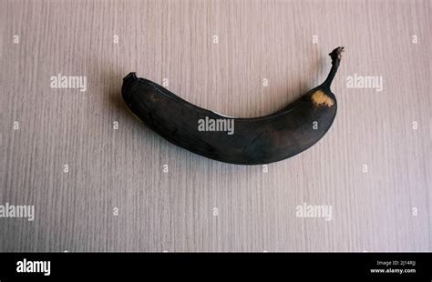 Photo Of An Old Spoiled Banana Black Rotten Banana Peel Stock Photo
