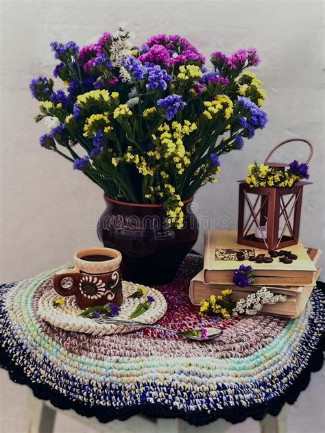 Vintage Still Life With Dried Flowers Books And A Cup On A White