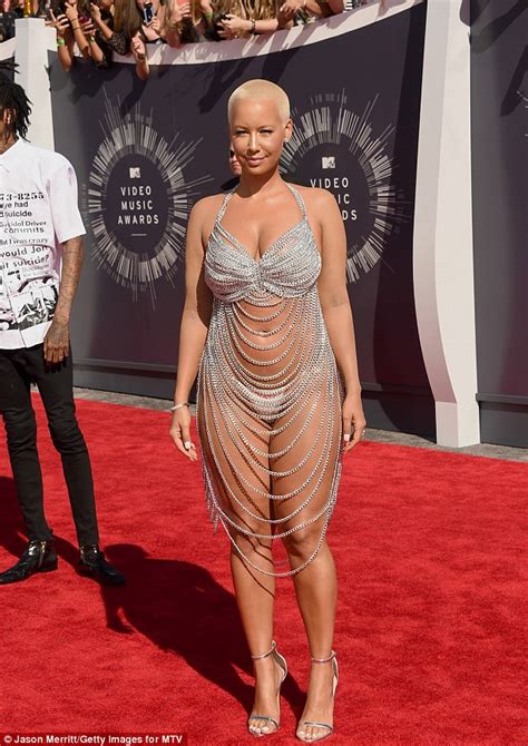 Amber Rose Bares Her Curvaceous Figure Beneath A Rear Revealing Chain