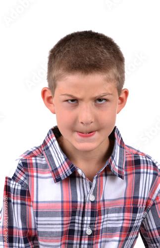 Young Boy Making A Mean Face Isolated On White Background Stock Photo