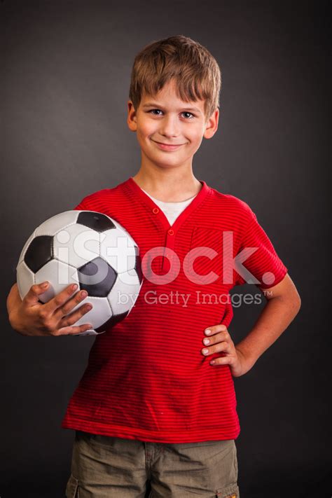 Cute Boy Is Holding A Football Soccer Ball Stock Photos