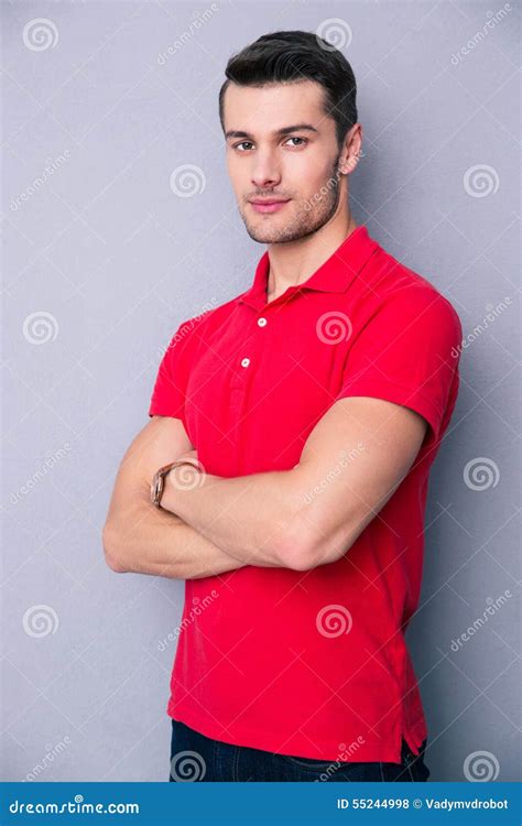 Handsome Young Man Standing With Arms Folded Stock Photo Image Of