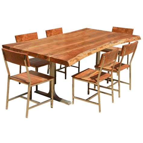 I had a butternut coffee table, console table, and 3 end tables made and they're all like works of art. Sierra Solid Wood Rustic Live Edge Dining Table & Chairs Set