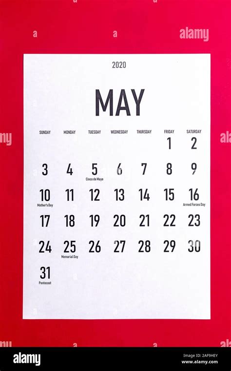 May 2020 Calendar With Holidays On Red Paper Background Stock Photo Alamy