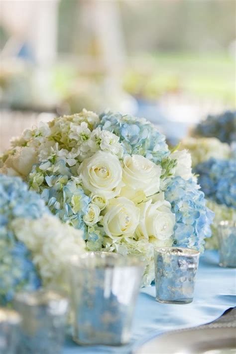 Pretty Spring Wedding Centerpieces With White Roses And Light Blue