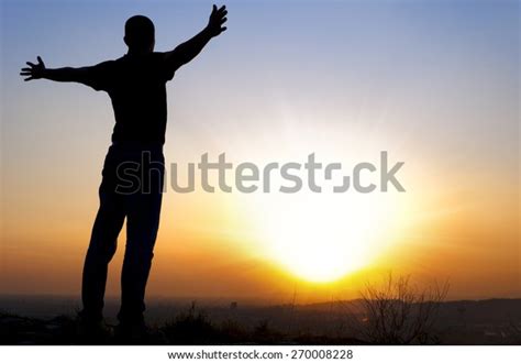 Silhouette Man Arms Outstretched Side Sunset Stock Photo Edit Now
