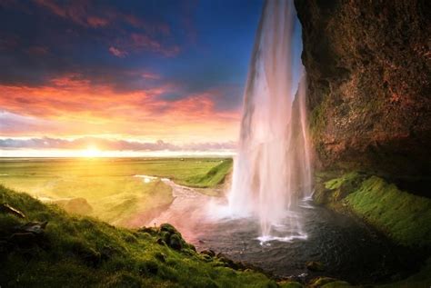 Seljalandsfoss Waterfall At Sunset Best Hotels In Iceland Iceland