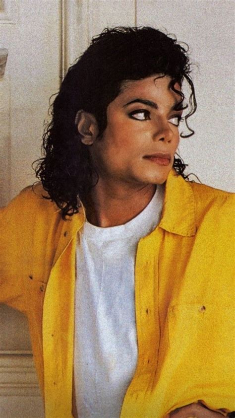 Michael Jackson In Yellow Jacket Leaning Against Wall