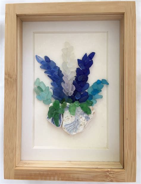 An Art Work With Sea Glass In A Frame