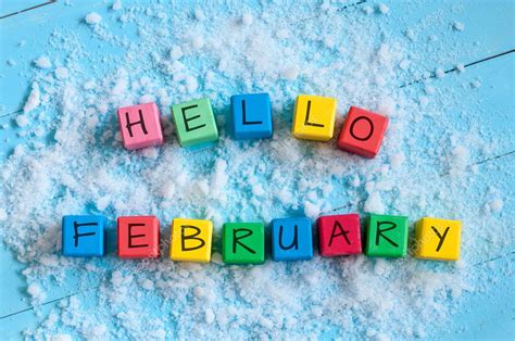 Hello February Cube Calendar For February On Wooden Surface With Snow