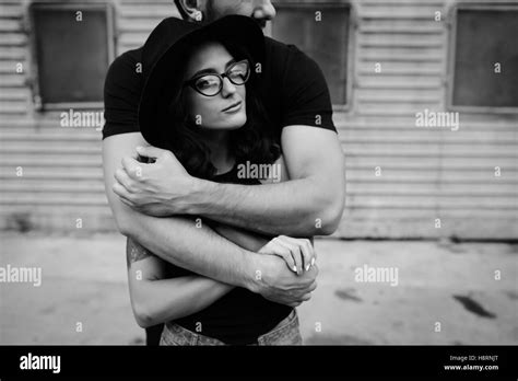 Guy Hugging His Girlfriend From Behind Stock Photo Alamy