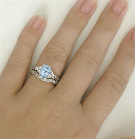 Aquamarine and diamond engagement rings are approximately the same price. Antique Aquamarine Engagement Ring in 14k white gold with ...