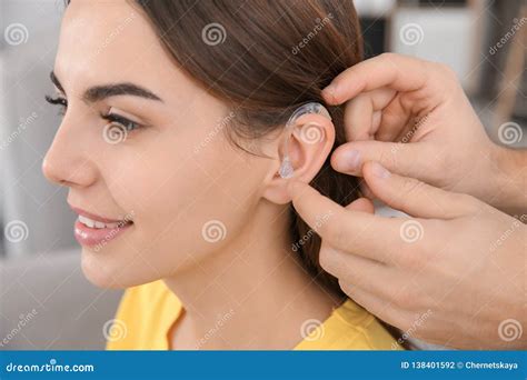 Man Putting Hearing Aid In Woman`s Ear Closeup Stock Photo Image Of