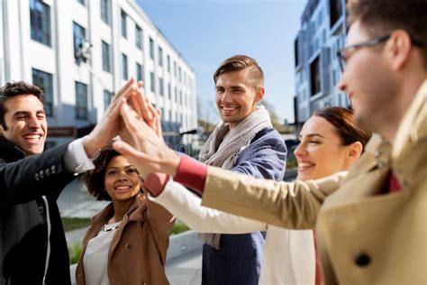 Group Of Happy People Making High Five In City Stock Image Image Of