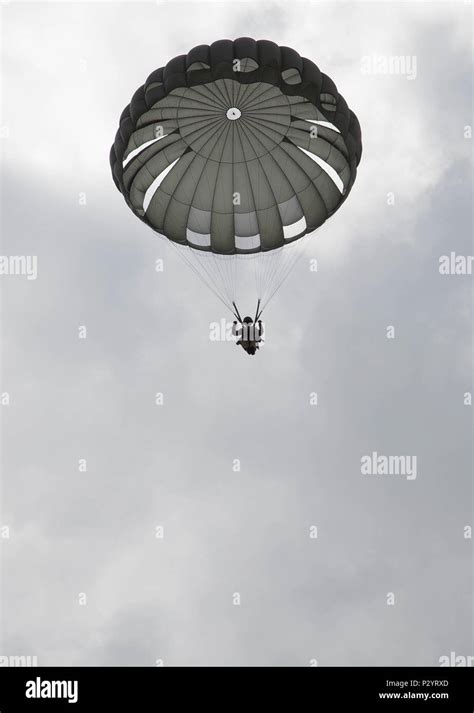 British Army Paratrooper Parachutes To A Drop Zone During Leapfest In