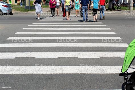 Pedestrian Crossing Through The Roadway Stock Photo Download Image