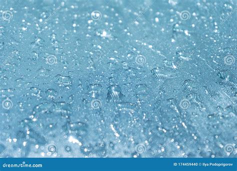 Rain Drops On The Blue Glass Bokeh Background Shiny Raindrops On A