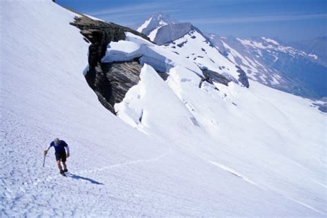 Man Climbing Snowfield Stock Photo Download Image Now Montana