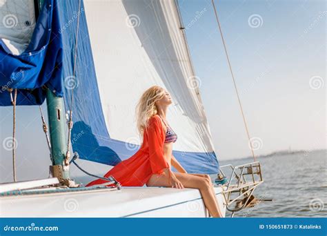 Young Beautiful Slim Girl In Bikini And Pareo Is Resting On Cruise On A