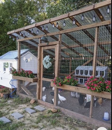 a chicken coop with flowers and chickens in it