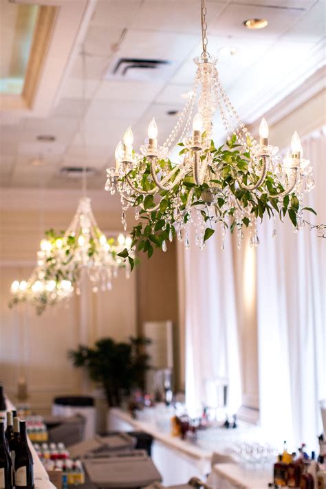 Chandeliers Hung With Greenery For A Winter Wedding Chandelier With