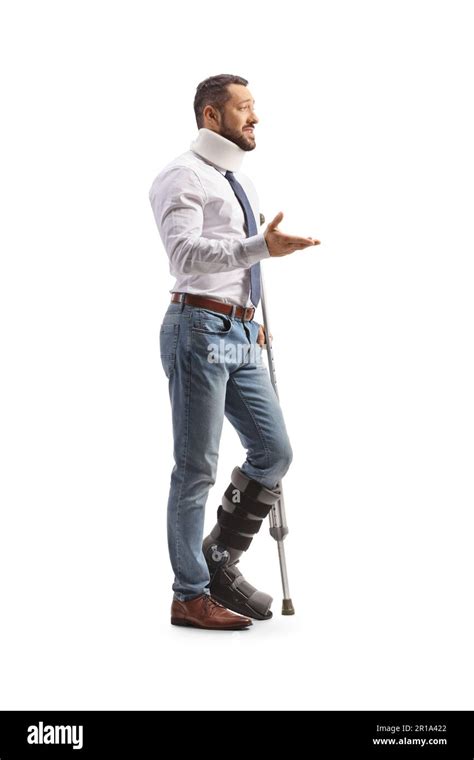 Young Man With An Orthopedic Boot And Cervical Collar Standing With A