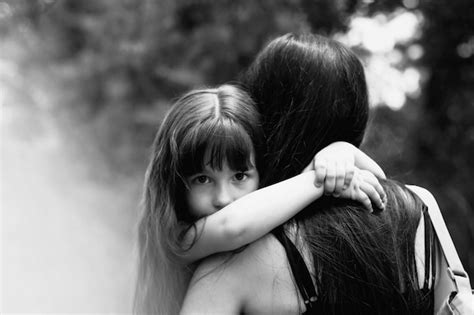 Premium Photo Little Girl Hugging Her Mother
