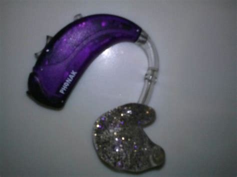 Purple Hearing Aids With Gold And Purple Glitter In The Earmolds