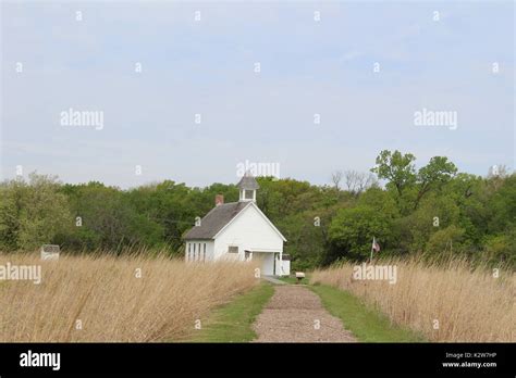 Old One Room School House At The End Of A Path Surrounded By Kansas