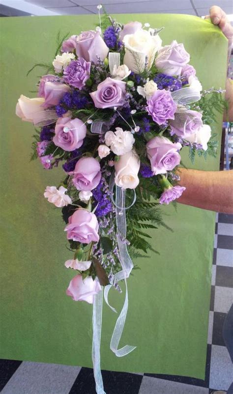 Purple Cascade Bouquet By Buds And Blossoms Wedding Flower Guide