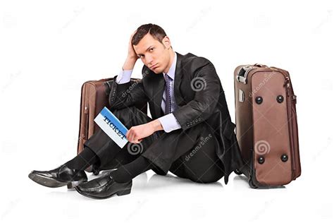 Sad Business Traveler Seated Next To A Suitcase Stock Image Image Of