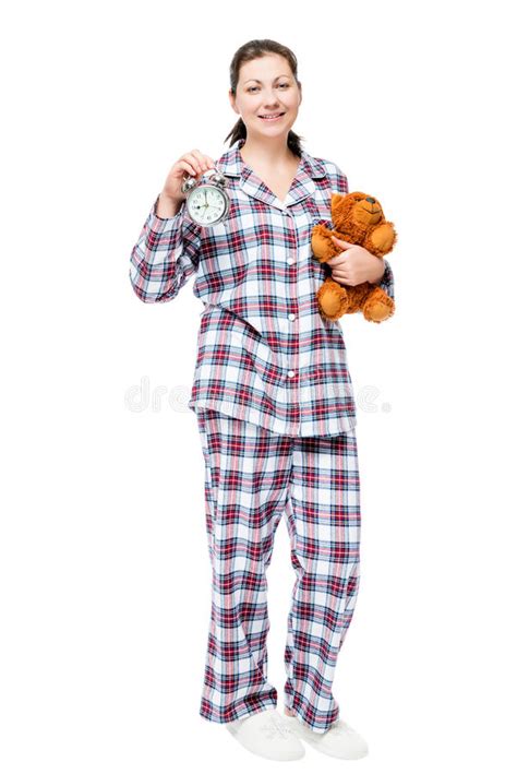 Girl In Pajamas With Teddy Bear And Alarm Clock Isolated Stock Image