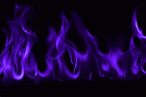 Beautiful Fire Purple Flames On A Black Background Stock Photo