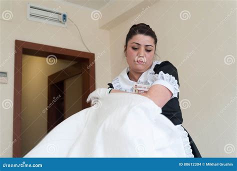 Maid Girl Dressed In Black And White Spreading Bed Editorial Image 80611576