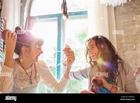 Women Playing With Yarn Together Stock Photo Alamy