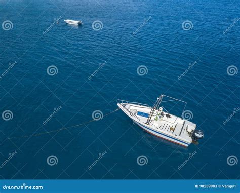 Aerial View Of A Moored Boat Floating On A Transparent Sea Stock Image
