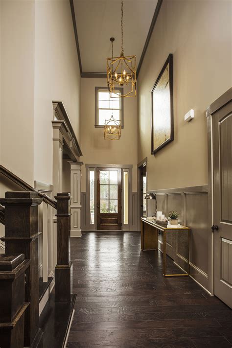 High Ceiling Entryway Featuring Gorgeous Chandeliers Dogwood Model