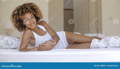 Beautiful African American Woman Lying On Bed Stock Photo Image Of