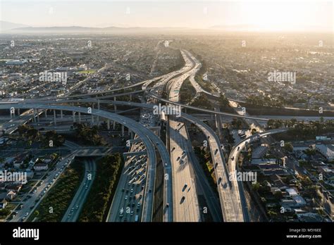 Aerial Sunrise View Of 105 And 110 Freeway Interchange Ramps In Los