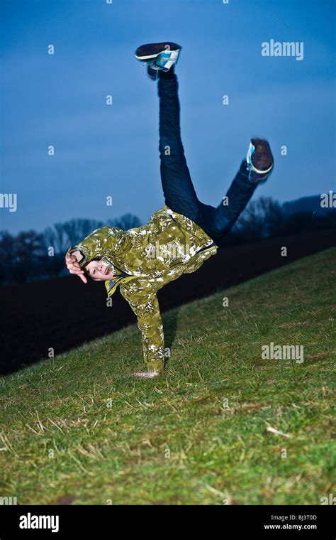 A Boy Doing A One Armed Handstand Stock Photo Alamy