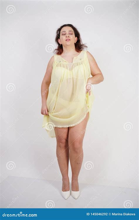 Pretty Chubby Girl Wearing Fashionable Yellow Underwear And Loves Her Body And Herself Plump