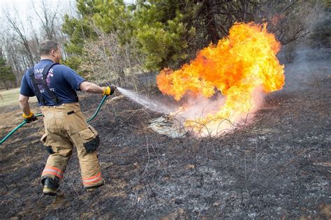Firefighters Battle Growing Number Of Brush Fires As Residents Begin