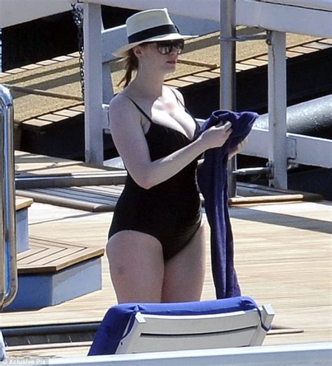 Christina Hendricks Causes A Lake Como Tion In Black Swimsuit As She Enjoys Dip In The Pool