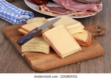 Assortment Sliced Cheeses Raclette On Cutting Stock Photo