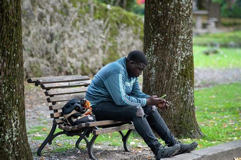 Black Man Sitting On A Bench At The Park Photograph By Cardaio Federico