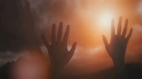 Silhouettes Of Hands Raised In Worship With Sunlight Stock Video