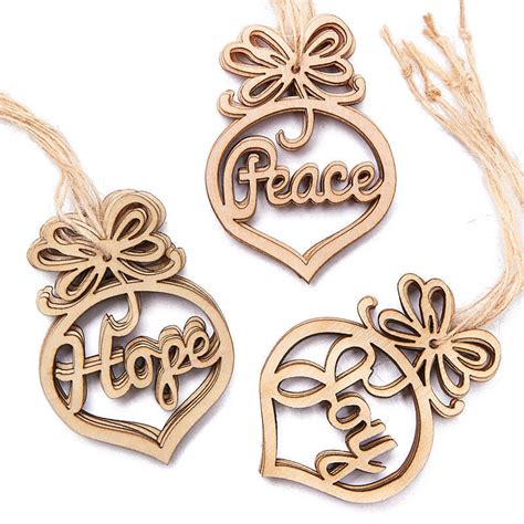 laser cut peace hope and joy wood ornaments christmas ornaments christmas and winter