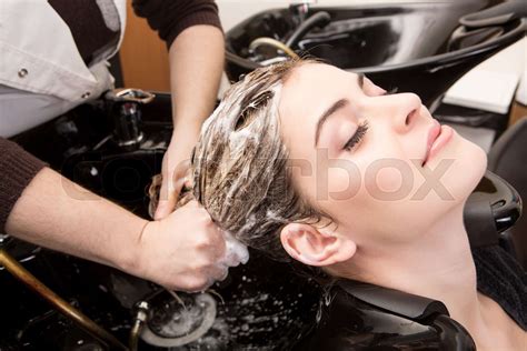 Woman Washing Her Hair In Hairsalon Stock Image Colourbox
