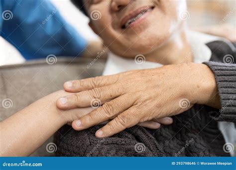 Elderly Touch Hand on Back of Hand Caregiver or Nurses To Express